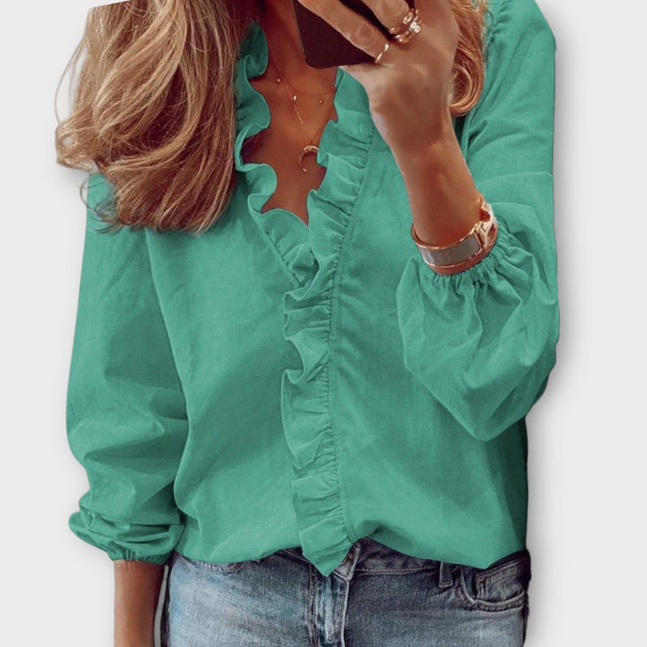 Women's Long Sleeve Relaxed Fit Ruffle Trim V Neck Blouse with Gathered Elastic Cuffs and Unprinted Solid Body
